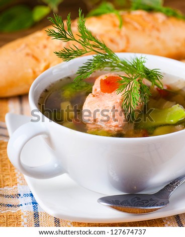 Fish a trout soup and bread with fennel