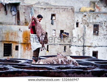 FES, MOROCCO - MARCH 4: Workers at leather factory perform the work on March 4, 2013. Tanning production is one of the most ancient in Morocco