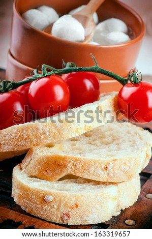 Mozzarella, tomatoes and bread. Italian food