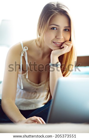 Young woman surfing the net at home