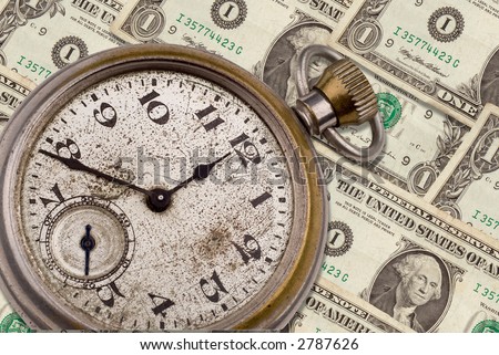 Antique pocket watch clock face on top of money isolated on white with a clipping path