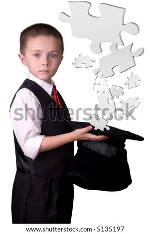 child dressed as a magician with hat full of puzzle pieces isolated over a white background