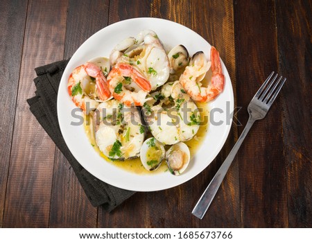 Similar – Foto Bild Seehechtfisch und Muscheln mit grüner Sauce