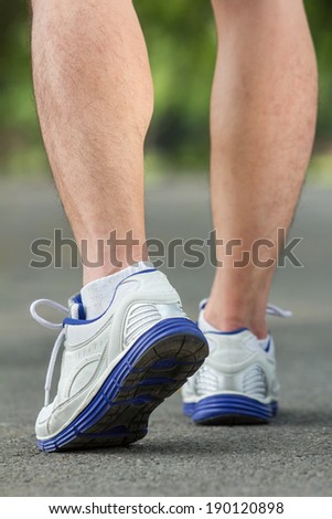 Athlete running sport feet on trail healthy lifestyle fitness