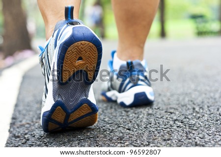 Woman walking cross country and trail