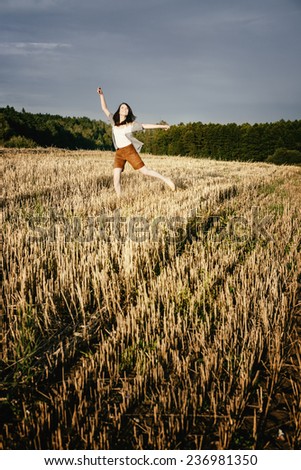 young beautiful free happy woman jumps happy with a smile
