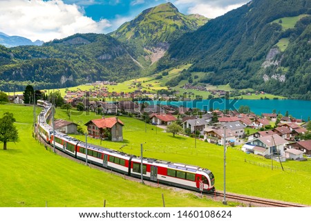 Similar – Foto Bild Roter Zug und Frühlingslandschaft bei Sonnenaufgang. Kontext der Frühjahrsreisen