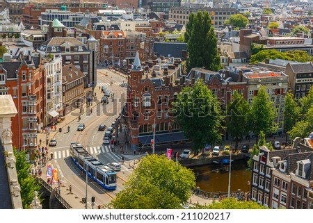 Amsterdam, Netherlands - August 5, 2014: Streets and canals in the city center. City view from the bell tower of the church Westerkerk, Holland, Netherlands on 5 August 2014.