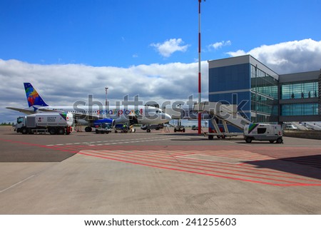 Vilnius, Lithuania - May 2, 2014: Preparation of aircraft Small Planet Airlines to fly, loading baggage, refueling at Vilnius airport