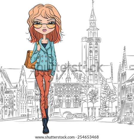 Beautiful fashion girl student in glasses with bag on a medieval city Bruges street