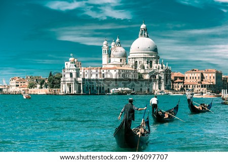 Picturesque view of Gondolas on Canal Grande with Basilica di Santa Maria della Salute in the background, Venice, Italy. Toning in cool tones