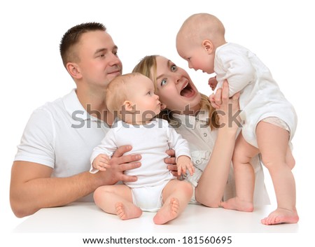 Young happy family mother and father with newborn child baby kids playing  yelling isolated on a white background