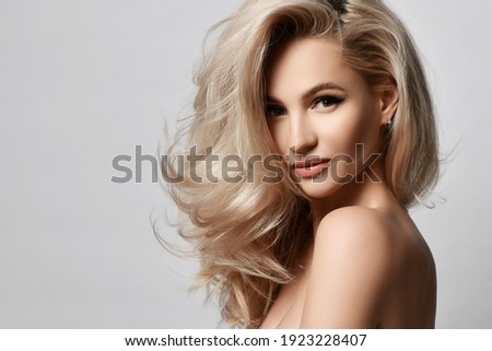 Healthy skin beautiful woman beauty skin and hair portrait natural make up. Blonde woman face clean healthy skin natural female spa glamour portrait on grey background 商業照片 © 