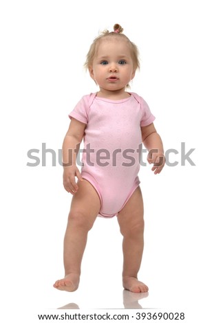 Similar – Image, Stock Photo Young toddler standing up looking at a fabric children’s book; eclectic decor with house plants