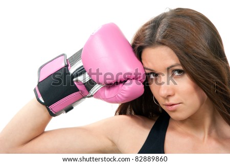Young beautiful boxing woman looking up with hands in pink and black box gloves near her head in fitness isolated on a white background