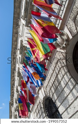 VIENNA, AUSTRIA - MAY 4: Flags on Hofburg palace on May 4, 2014 in Vienna. The Imperial Palace Hofburg is the most representative example of ViennaÃ¢Â?Â?s characteristic variety of architecture styles.