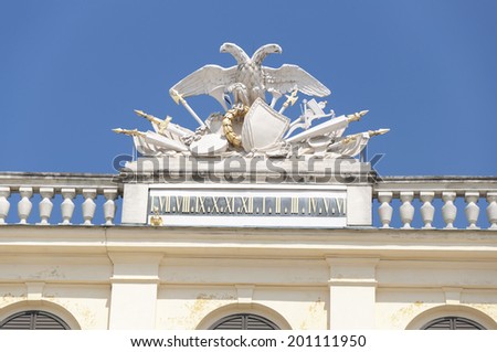 VIENNA, AUSTRIA - MAY 3: Double-Headed Eagle atop Schonbrunn Palace on May 3, 2014 in Vienna. The double-headed eagle, the emblem of Habsburg dominion, was adopted of the Eastern Roman Empire.