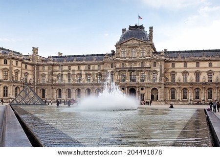 PARIS, FRANCE - MARCH 27: Louvre museum on March 27, 2014 in Paris. The museum is housed in the Louvre Palace, originally built as a fortress in the late 12th century under Philip II.