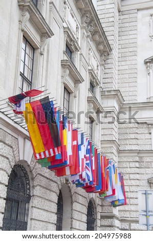 VIENNA, AUSTRIA - MAY 4: Flags on Hofburg palace on May 4, 2014 in Vienna. The Imperial Palace Hofburg is the most representative example of ViennaÃ¢Â?Â?s characteristic variety of architecture styles.