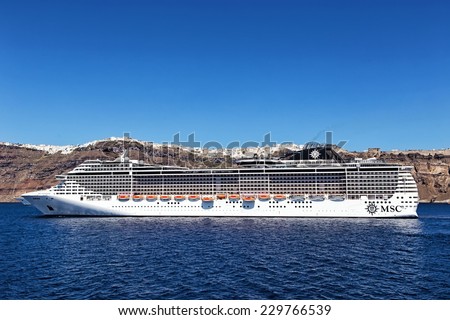 SANTORINI, GREECE-AUGUST 20: MSC Fantasia cruise ship near Santorini island in Aegean sea. MSC Fantasia is the largest cruise ship ever built for a European ship owner. It has  1637 staterooms.