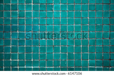 Light turquoise tile of the bathroom wall