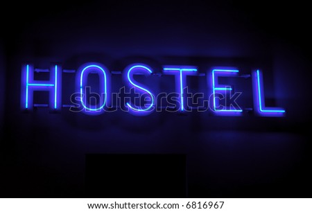 Hostel inscription in neon lights at night