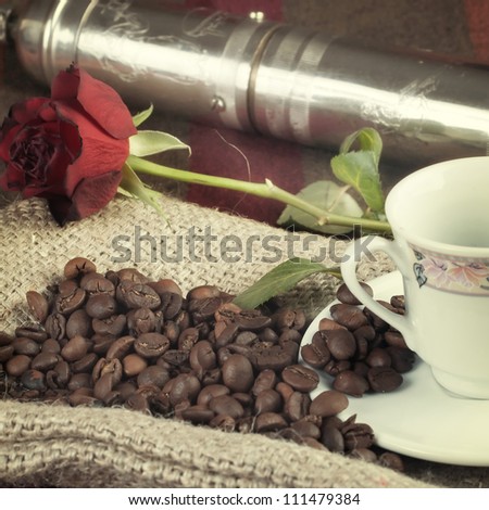 coffee grinder, coffee beans and roses on the table