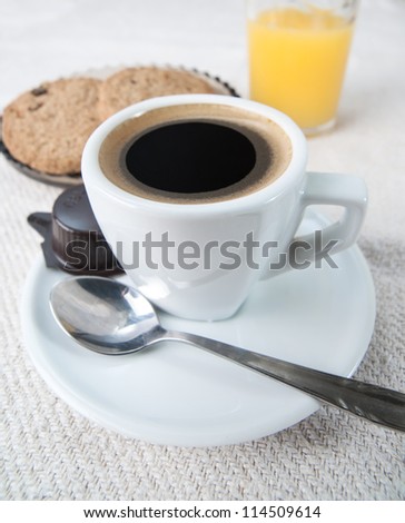 Chocolate Chip Cookies with Cup of Coffee on white fabric