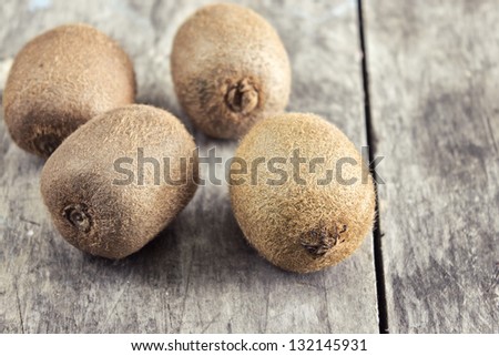 Close up of  fresh kiwi on wooden table top