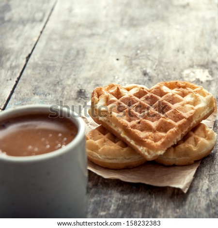 heart shaped waffles and coffee on table