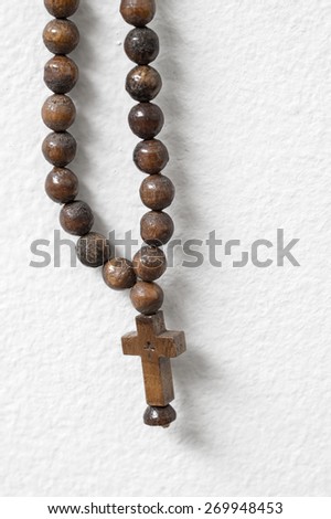 Similar – Image, Stock Photo A rosary hangs from an open Christian prayer book with the Our Father