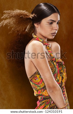 Woman in ethnic dress in the studio