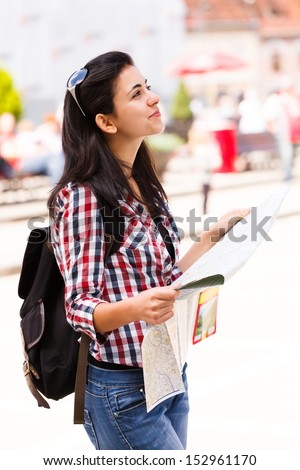 Young tourist woman thinking on what path should she choose.