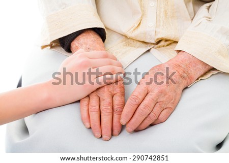 Supporting hands for senior woman.