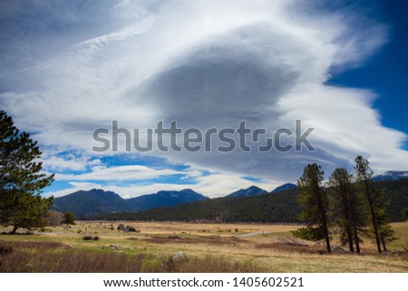 Similar – Image, Stock Photo Eerie cloud formation over the vast land