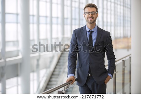 Handsome smiling confident businessman portrait