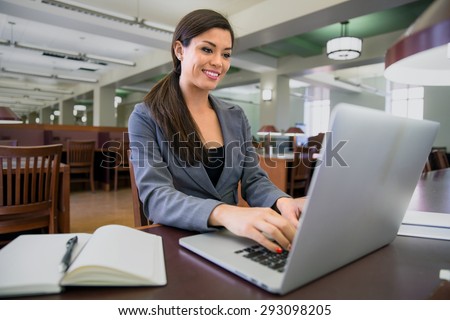 Business woman executive in the library researching attorney lawyer