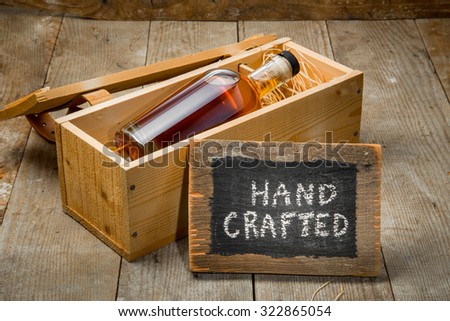 Hand crafted whisky bourbon rum spirit bottle in wooden gift package box