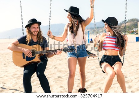 Female male group musician sing laugh play smile friendship bonding wasting time enjoying life