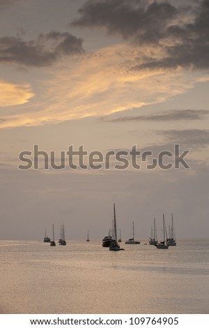 Sail boats in the shore at sunset . Portobelo, Caribbean, Colon province, Panama, Central America.
