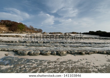 Rocky sea bed in low tide at Isla Pacheca shore. Las Perlas Archipelago, Panama Province, Panama, Central America.