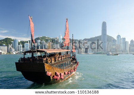 Traditional wooden sailboat / tourist junk sailing in Victoria Harbour ,Hong Kong