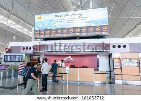 HONG KONG, CHINA - FEBRUARY 11: Passengers in the airport main lobby on February 11, 2013 in Hong Kong, China. The Hong Kong airport handles more than 70 million passengers per year.
