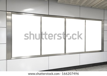 Four big vertical / portrait orientation blank billboard in public transport