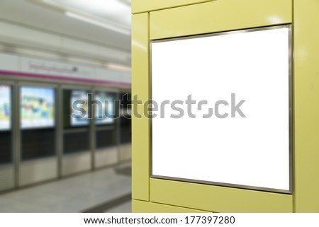 One big vertical / portrait orientation blank billboard in public transport with subway platform background