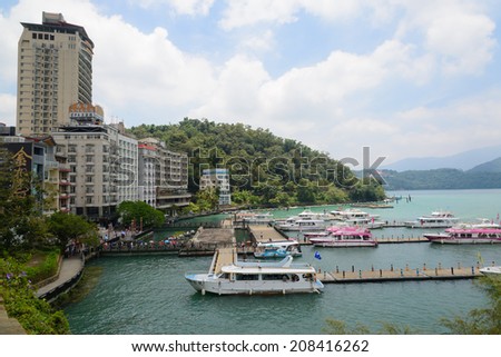 SUN MOON LAKE - JULY 15: boats park at the pier on July 15, 2014 at Sun Moon Lake, Taiwan. Sun Moon Lake is the largest body of water in Taiwan as well as a tourist attraction.