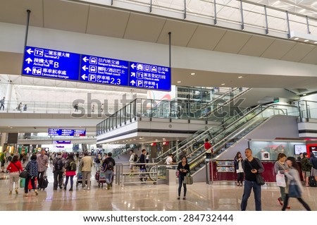 HONG KONG, CHINA - MAY 4: Passengers in the airport main lobby on MAY 4, 2015 in Hong Kong, China. The Hong Kong airport handles more than 70 million passengers per year.