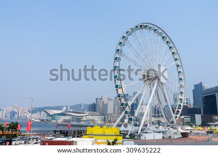 Hong Kong, China - AUG 25, 2015: Skyscrapers and Hong Kong Observation Wheel, which is the latest tourist attraction in the city.