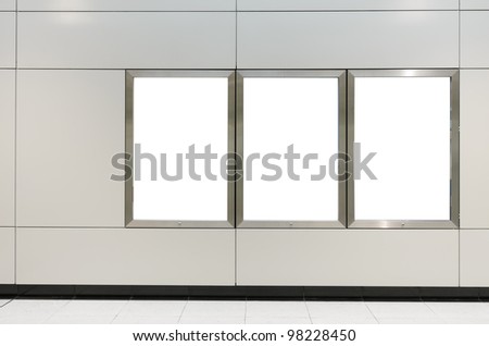 Three big vertical / portrait orientation blank billboard on modern white wall