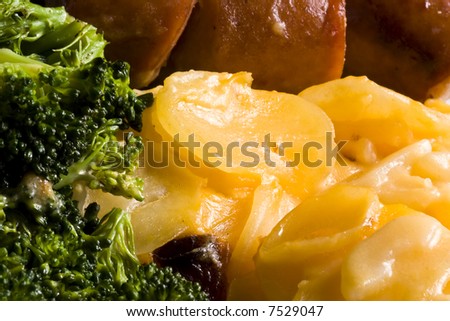 nice home cooked meal of sausage potatoes and broccoli